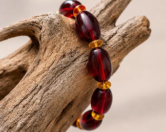 Armband aus kirschrotem Bernstein, polierte ovale Perlen mit honigfarbenen Zwischenperlen, Stretch-Schmuck