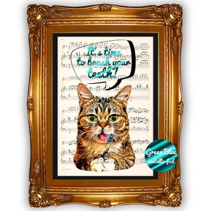 May include: Framed artwork featuring a tabby cat holding a toothbrush, with the text "It's a time to brush your teeth!" in a speech bubble. The artwork is set against a backdrop of musical notes and framed in a gold ornate frame.