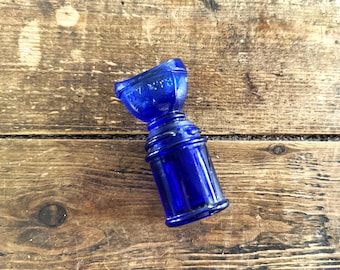 Tapón y botella para lavado de ojos de vidrio azul cobalto de WYETH Bro., estilo años 20/30.