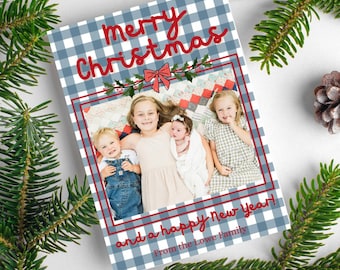 May include: A blue and white gingham Christmas card with the text "Merry Christmas and a Happy New Year!" and a photo of four children. The card is signed "From the Lowe Family."