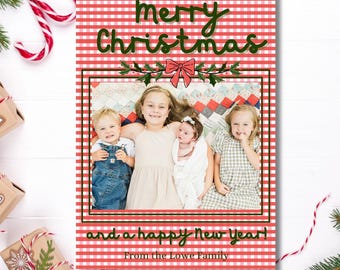 May include: A red and white gingham Christmas card with a photo of four children. The card reads "Merry Christmas and a Happy New Year! From the Lowe Family."