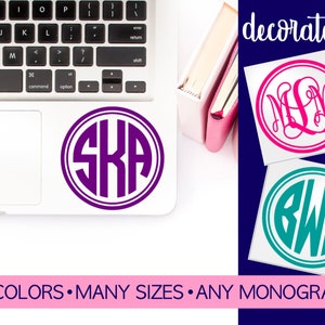 May include: Two monogram stickers, one with the letters "SKA" in purple and one with the letters "BWS" in teal. Both stickers have a white background and a white circle around the letters. The text "decorate it!" is in the top right corner of the image. The text "40 COLORS MANY SIZES ANY MONOGRAM" is at the bottom of the image.