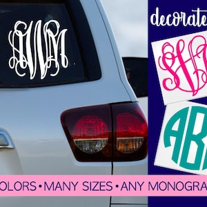 May include: A white vinyl monogram decal applied to a car rear window, with additional pink script and teal block letter monogram stickers shown on the side. The text "decorate it!" and "40 COLORS • MANY SIZES • ANY MONOGRAM" is visible.
