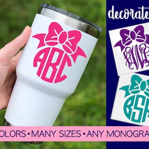 May include: White tumbler with a pink bow and monogram decal. The decal says "ABC". The tumbler is shown in a hand. The image also shows two other decals with bows and monograms. One decal is purple with the monogram "LVP" and the other is teal with the monogram "BSR". The text "decorate it!" is at the top of the image. The text "40 COLORS - MANY SIZES - ANY MONOGRAM" is at the bottom of the image.