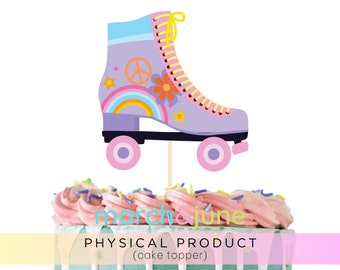 May include: A lavender roller skate cake topper with a peace sign, rainbow, and flower design. The skate has yellow laces and pink wheels. The cake topper is on top of a cake with pink frosting and sprinkles. The text "march & june" and "PHYSICAL PRODUCT (cake topper)" are visible.