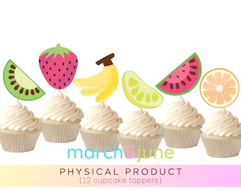 May include: Twelve cupcake toppers featuring various fruit designs. The toppers include a strawberry, a banana, a kiwi slice, a lime slice, a watermelon slice, and an orange slice. The toppers are printed on cardstock and have a white background.
