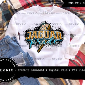 May include: White sweatshirt with a black, blue, and yellow graphic design that says "Jaguar Pride". The graphic features a lightning bolt with a leopard print pattern.