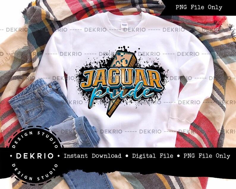 May include: White sweatshirt with a black, blue, and yellow graphic design that says "Jaguar Pride". The graphic features a lightning bolt with a leopard print pattern.