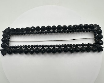 Broche con hebilla de luto de cristal azabache francés negro macizo de estilo victoriano antiguo