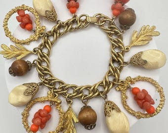 Vintage Victorian Revival gold tone faux coral lucite glass charms bracelet