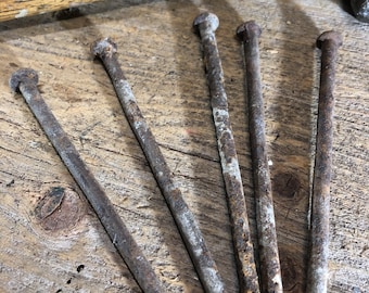 Vintage rusty spike nails, not square nails