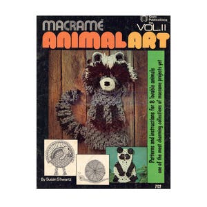 May include: A book cover for a macrame animal art project. The cover features a raccoon, a turkey, a snail, and a panda bear. The title of the book is "Macrame Animal Art" and the subtitle is "Patterns and instructions for 8 lovable animals".