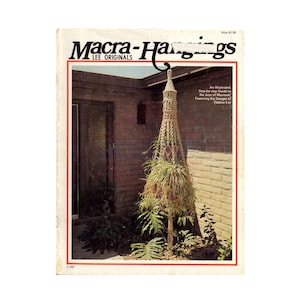 May include: A magazine cover for Macra-Hangings Lee Originals, featuring a macrame plant hanger in a terracotta pot, with a brick wall background. The text on the cover reads "An Illustrated, Step-by-step Guide to the Joys of Macrame" and "Featuring the Designs of Thelma Lee".
