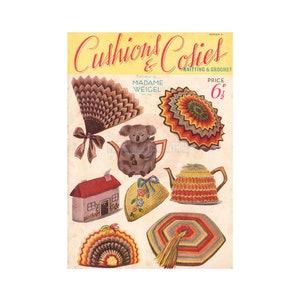 May include: A vintage magazine cover featuring colorful crocheted and knitted items, including a teapot cozy, a house cozy, and a fan-shaped coaster. The magazine is titled "Cushions & Cosies" and is published by Madame Weigel. The price is 6 1/2 pence.