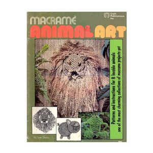 May include: A book cover with the title "Macrame Animal Art" featuring a lion, pig, and frog made with macrame. The book cover is green and brown with a white border.