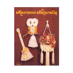 May include: A vintage book cover featuring the title "Macrame Naturally" with a white owl clock, a macrame plant hanger with flowers, and a macrame tassel. The book cover is brown with a yellow and orange title.