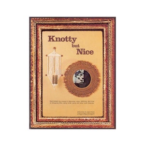 May include: A vintage magazine cover with a brown frame featuring a macrame wall hanging and a macrame mirror. The text on the cover reads "Knotty but Nice".