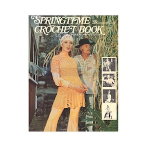 May include: Cover of a vintage crochet book titled "Springtime Crochet Book." The cover features a woman wearing a crocheted orange outfit with matching pants and a crocheted hat. A man in a hat stands behind her. The cover includes small black and white photos.