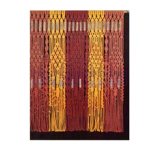 May include: A macrame curtain with alternating stripes of red and yellow cord. The curtain is made of a series of knots and loops, creating a textured and intricate design.