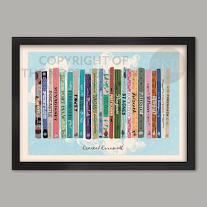 May include: A framed print depicting a row of colorful book spines, each inscribed with a Cornish coastal town. The print has a light blue backdrop with white floral designs and the words "Coastal Cornwall".