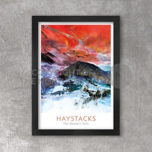 May include: A framed abstract painting of a mountain range with a red, orange, and blue sky. The title of the painting is "HAYSTACKS The Western Fells".