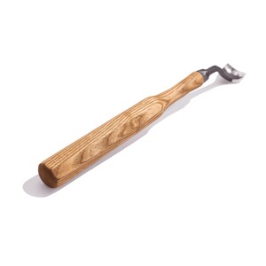 May include: A wooden handled carving tool with a metal blade. The tool is designed for woodworking and has a curved blade.