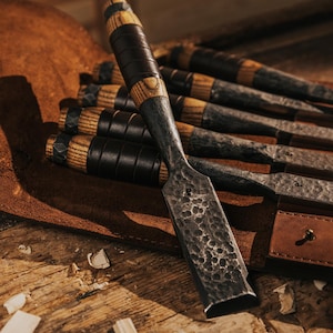 Set of Six Chisels with Beveled Edges and Rings in the end in leather bag with leather wrapping on handles