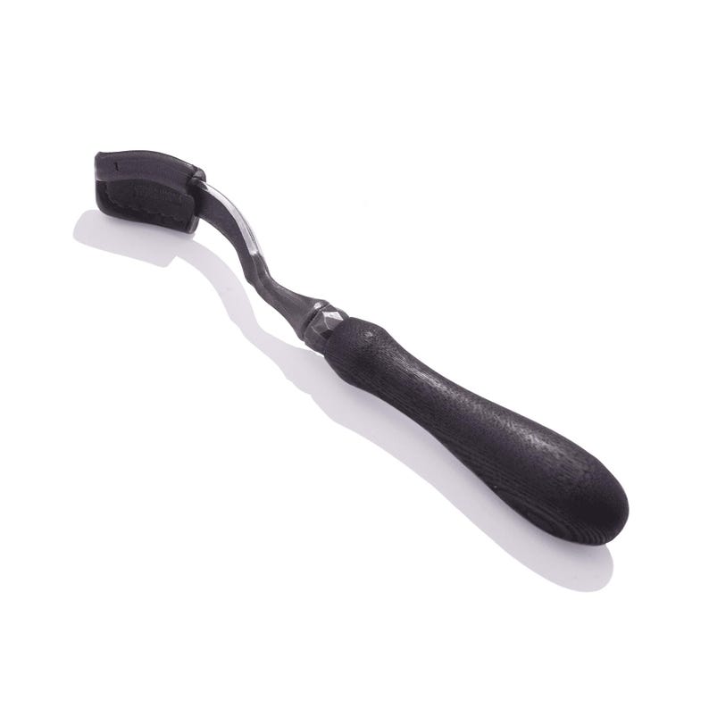 May include: A black wood handled carving tool with a curved blade and a black leather strop.