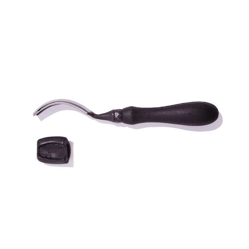 May include: A black handled leather crafting tool with a curved blade. The tool is made of metal and has a black plastic handle.