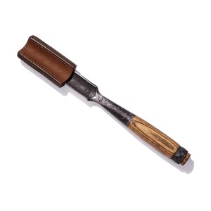 May include: A brown leather sheath with a wood-handled chisel with a metal blade. The chisel is about 12 inches long.