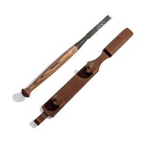 May include: A wooden-handled carving tool with a metal blade and a brown leather sheath.