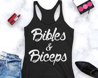 May include: Black tank top with white text that reads "Bibles & Biceps".