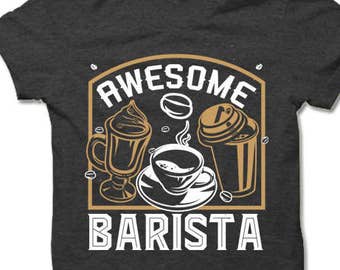May include: A dark gray t-shirt with a white graphic design that says "Awesome Barista" and features a coffee cup, a coffee drink, and a coffee bean.