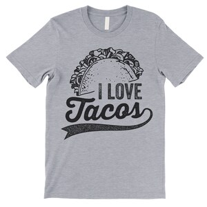Może przedstawiać: Szary t-shirt z nadrukiem czarno-białego rysunku taco i napisem "I love Tacos".
