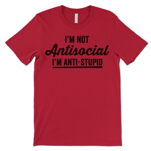 May include: Red t-shirt with black text that reads "I'm not antisocial I'm anti-stupid".