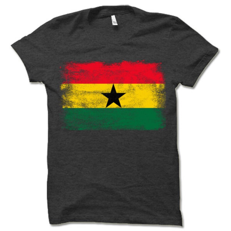 May include: A dark grey t-shirt with a distressed, faded design of the flag of Ghana. The flag features red, yellow, green, and a black star.