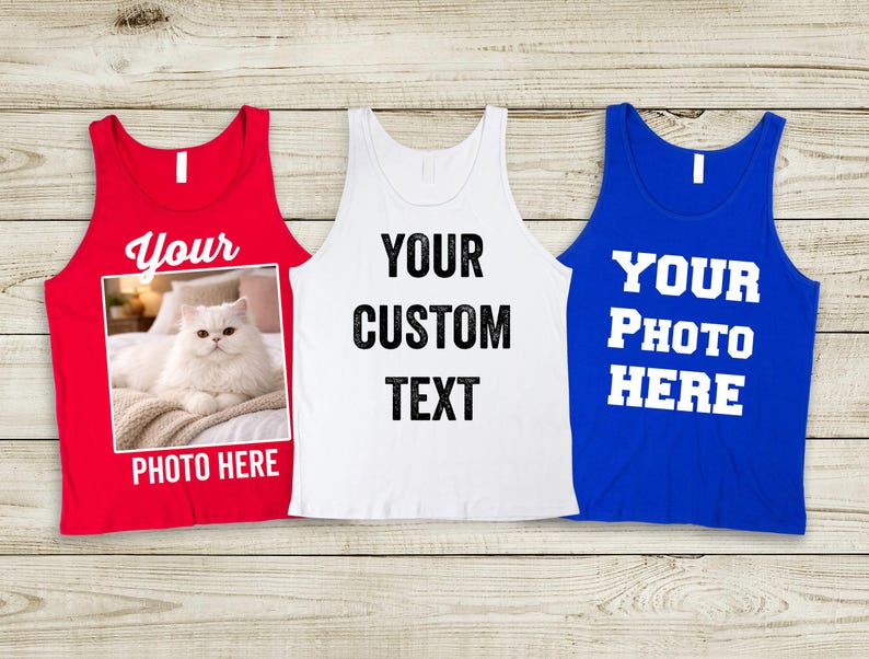 May include: Three tank tops in red, white, and blue. The red tank top has a photo of a white cat and the text "Your Photo Here". The white tank top has the text "Your Custom Text". The blue tank top has the text "Your Photo Here".