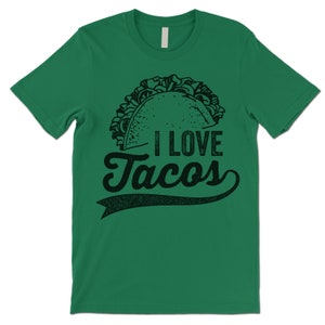 Może przedstawiać: Zielona koszulka z czarno-białym rysunkiem taco i tekstem "Kocham tacosy".