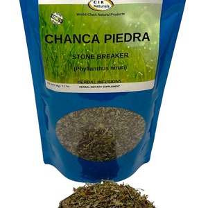 May include: A blue pouch of Chanca Piedra herbal infusion with a clear window showing dried leaves. The label reads "CHANCA PIEDRA STONE BREAKER" and "HERBAL DIETARY SUPPLEMENT". A pile of dried leaves is in front of the pouch.