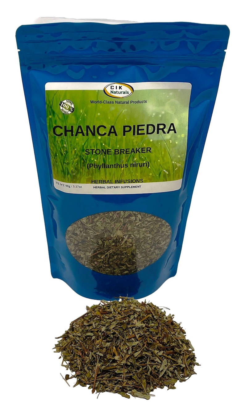 May include: A blue pouch of Chanca Piedra herbal infusion with a clear window showing dried leaves. The label reads "CHANCA PIEDRA STONE BREAKER" and "HERBAL DIETARY SUPPLEMENT". A pile of dried leaves is in front of the pouch.