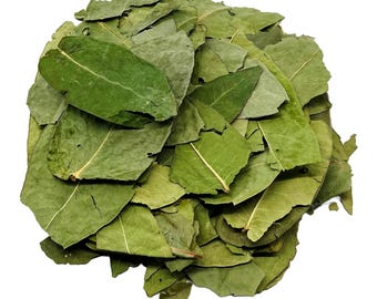 May include: A pile of dried coca leaves, a traditional South American plant used for medicinal and ceremonial purposes.