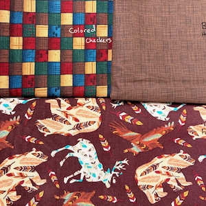 May include: Fabric swatches with different patterns. One has a patchwork design in red, blue, yellow, and green. Another is a plain brown with a textured pattern. The third has a repeating animal and feather design.