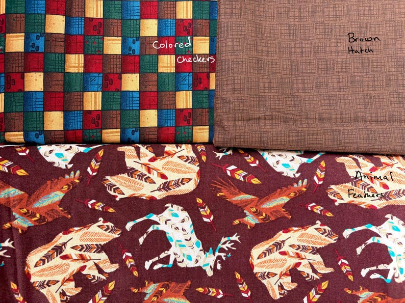 May include: Fabric swatches with different patterns. One has a patchwork design in red, blue, yellow, and green. Another is a plain brown with a textured pattern. The third has a repeating animal and feather design.