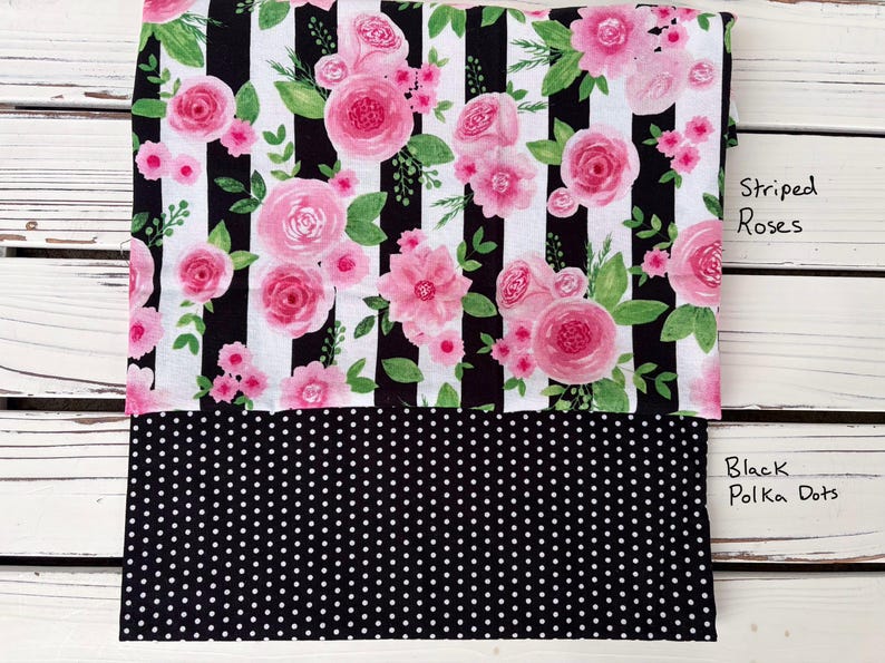 May include: Fabric featuring pink roses and green leaves on a black and white striped background. The lower section displays black fabric with white polka dots. Text reads "Striped Roses" and "Black Polka Dots."