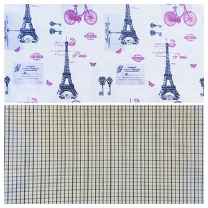 May include: White fabric with a repeating pattern of the Eiffel Tower, bicycles, keys, and butterflies in purple and black. The bottom half features a tan and black plaid pattern.