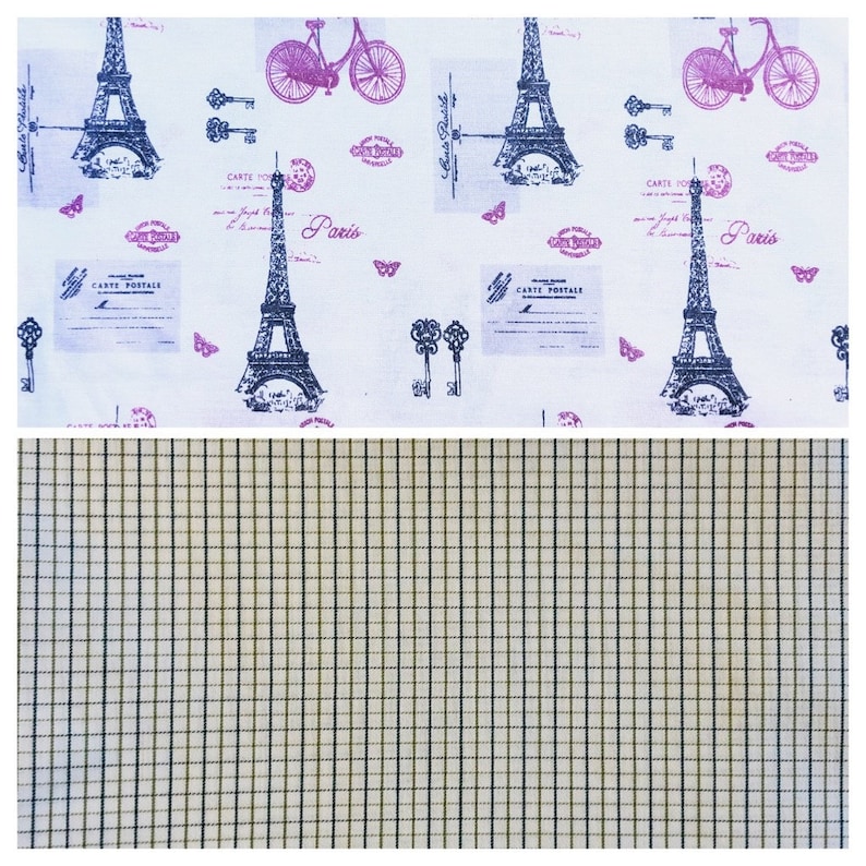 May include: White fabric with a repeating pattern of the Eiffel Tower, bicycles, keys, and butterflies in purple and black. The bottom half features a tan and black plaid pattern.