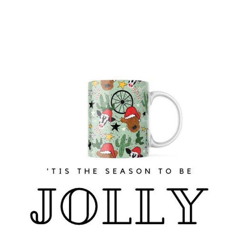 May include: White ceramic mug with a green background and a repeating pattern of reindeer, cacti, stars, and candy canes. The mug has a white handle and the text 'Tis the season to be JOLLY printed below the mug.