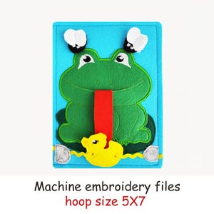 May include: A felt frog toy with a red tongue, yellow duck, and two white and black flies on a blue background. The text "Machine embroidery files" and "hoop size 5X7" are at the bottom.