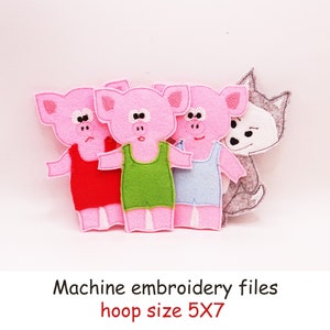 Può includere: File di ricamo a macchina per un cerchio da 5x7 cm con tre maiali rosa che indossano camicie di diversi colori e un lupo grigio.