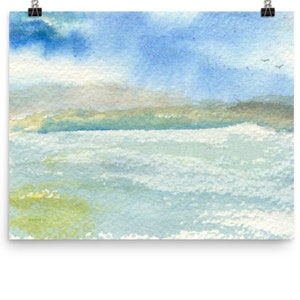 May include: A watercolor painting of a seascape with a light blue sky, white clouds, and a green and brown shoreline. The water is a light blue and green color with whitecaps.
